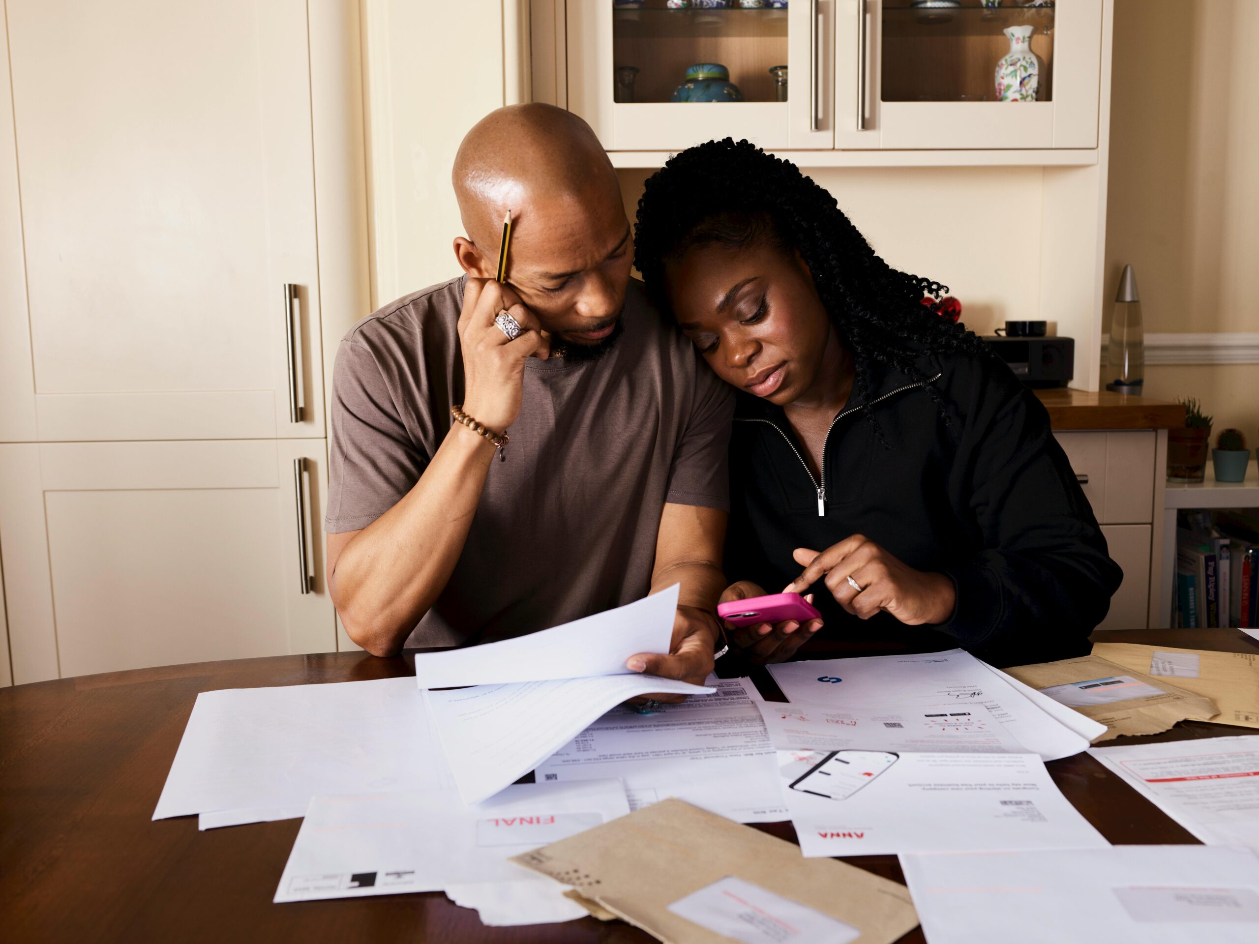 Couple reviewing household finances together